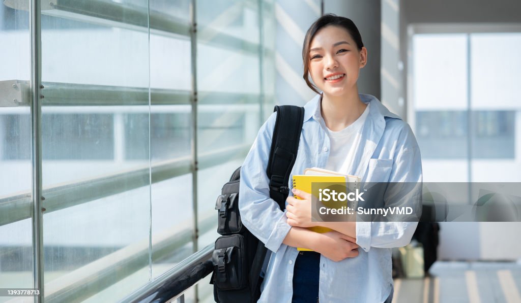 Image of young Asian college girl at school